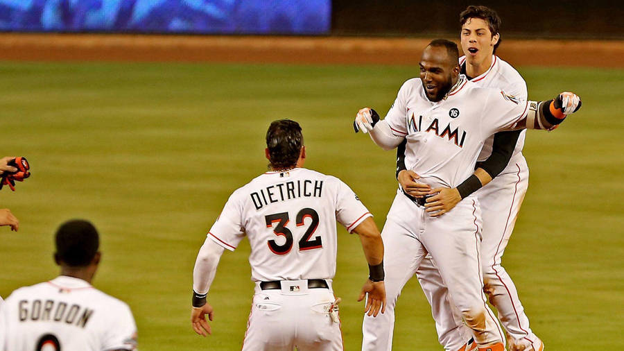 Marcell Ozuna Hugged By Teammate Wallpaper