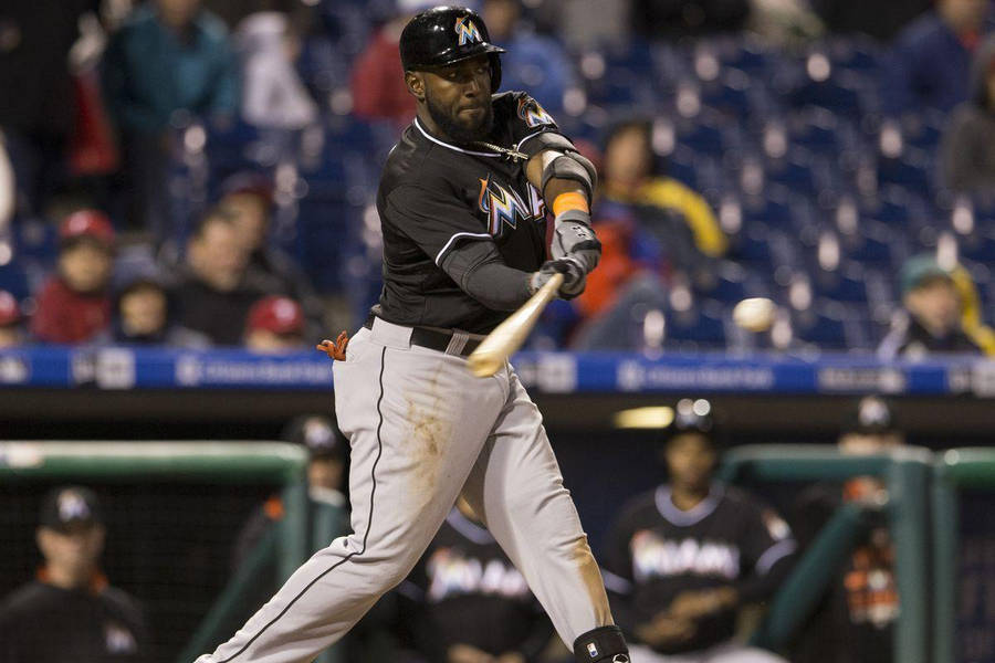 Marcell Ozuna Swinging A Baseball Bat Wallpaper