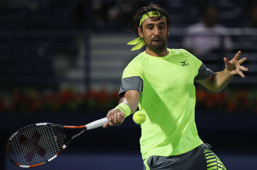 Marcos Baghdatis In Action, Speedily Aims For The Tennis Ball. Wallpaper