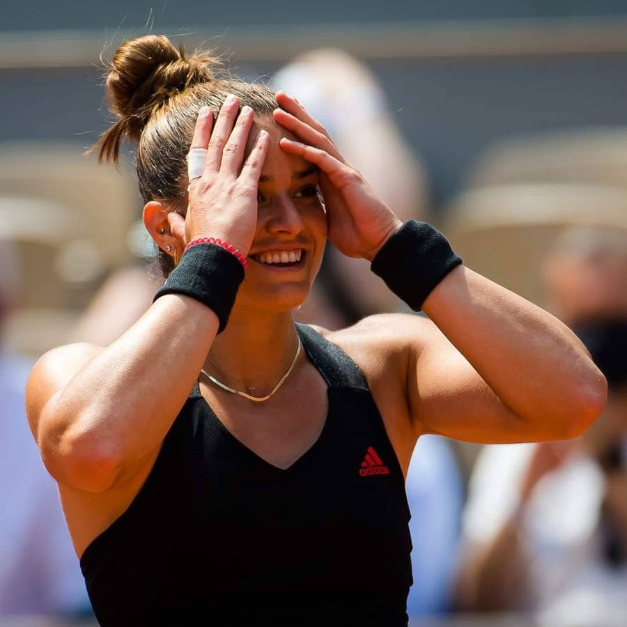 Maria Sakkari In Emotional Moment On Tennis Court Wallpaper