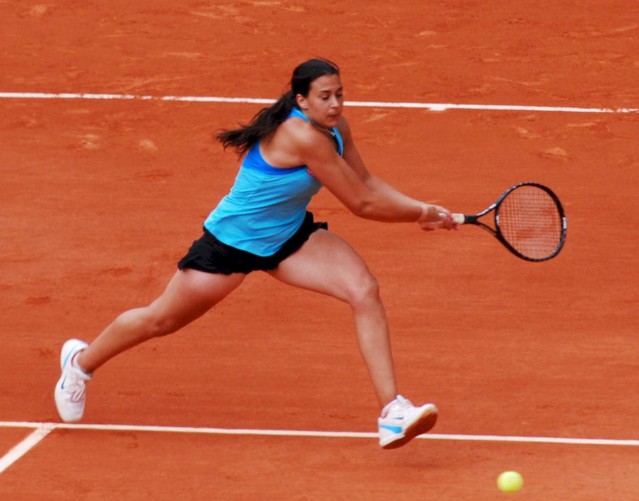 Marion Bartoli In Action On A Clay Court Wallpaper