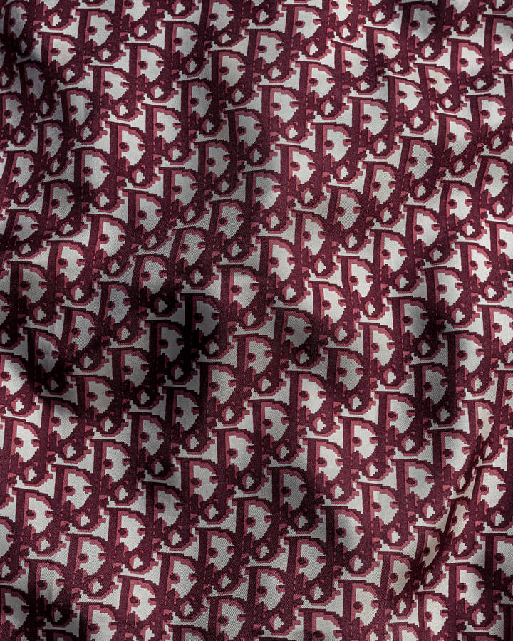 Maroon Oblique Pattern Dior Designer Logo Wallpaper