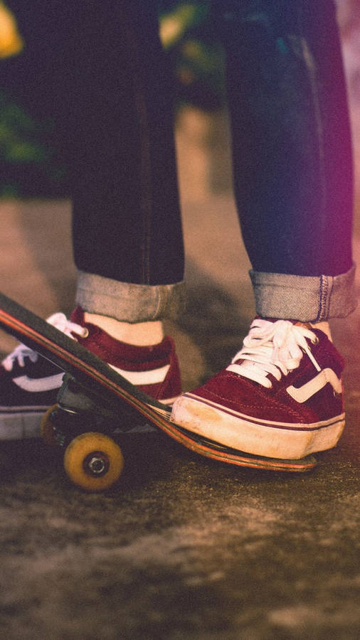 Maroon Vans Shoes With Skateboard Iphone Wallpaper