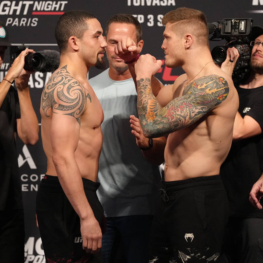 Marvin Vettori And Robert Whittaker Staredown Wallpaper