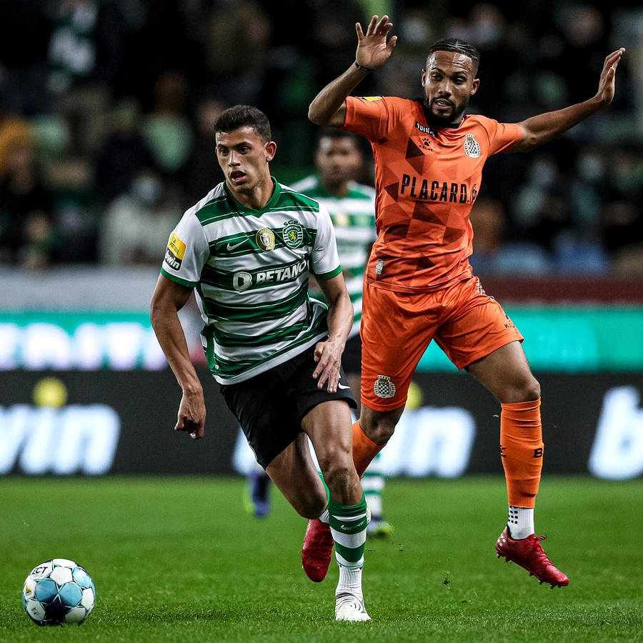 Matheus Nunes In Action During A Football Match Wallpaper