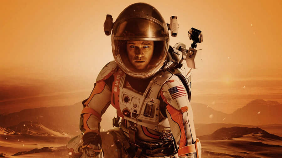 Matt Damon As Mark Watney Standing On The Harsh Martian Landscape Wallpaper