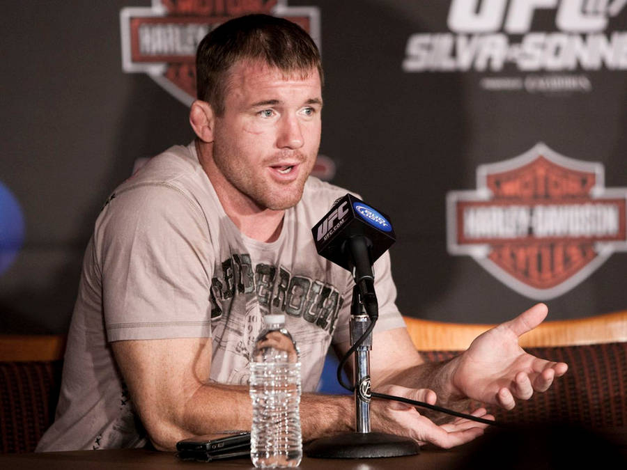 Matt Hughes Gesturing During Interview Wallpaper