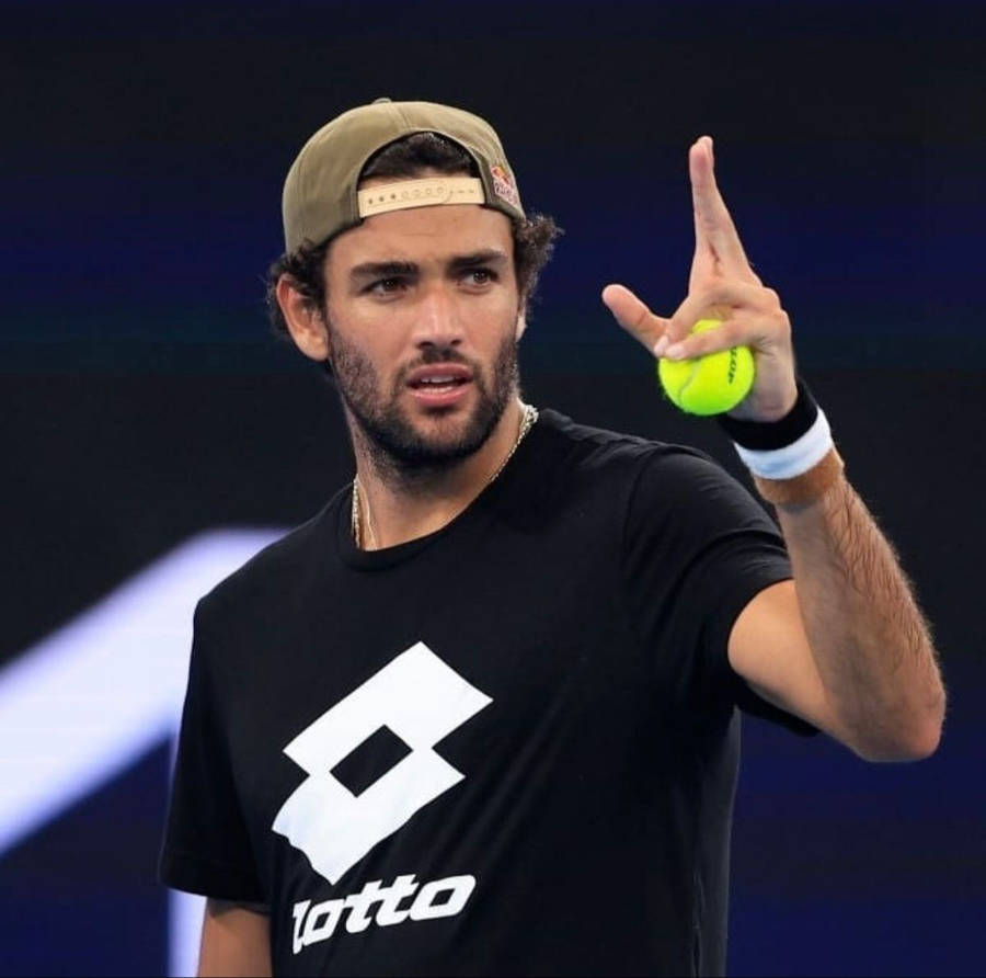 Matteo Berrettini Holding A Tennis Ball Wallpaper