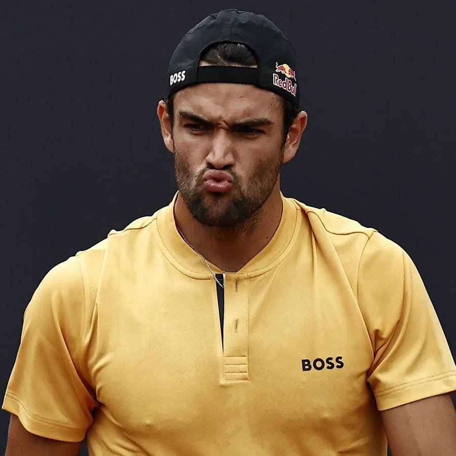 Matteo Berrettini In An Intense Moment On The Tennis Court Wallpaper