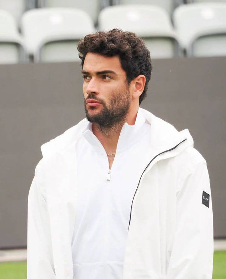 Matteo Berrettini In White Jacket Wallpaper