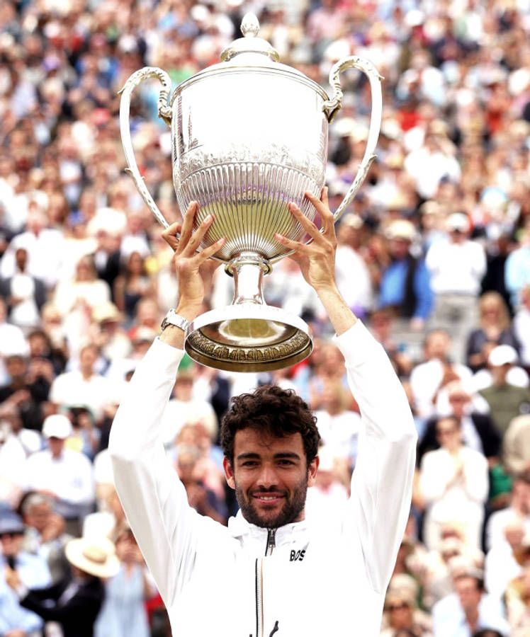 Matteo Berrettini Raising A Trophy Wallpaper