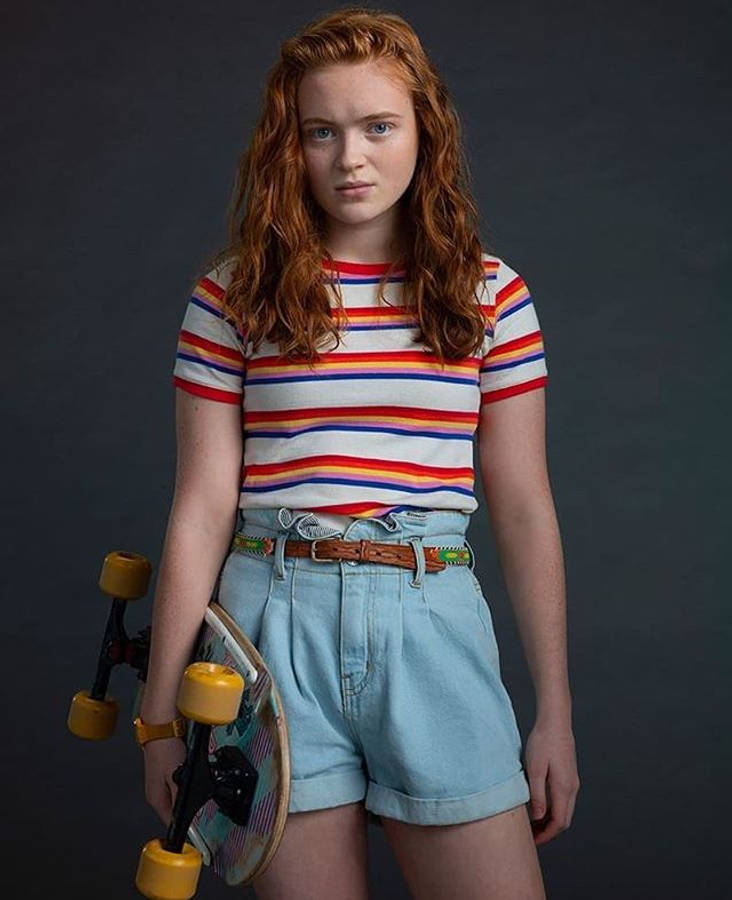 Max From Stranger Things Carrying Skateboard Wallpaper