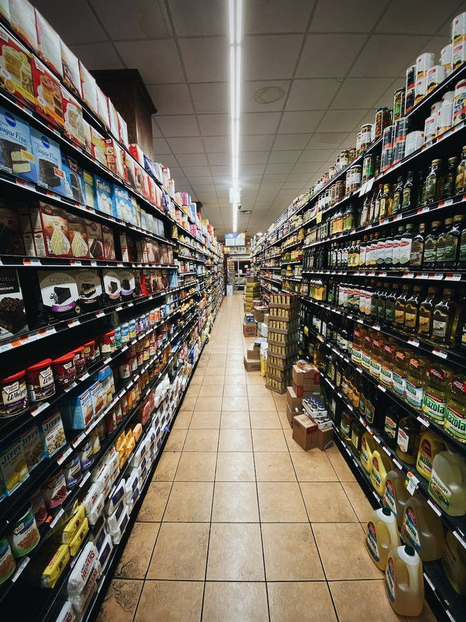 Messy Grocery Store Aisle With Boxes Wallpaper