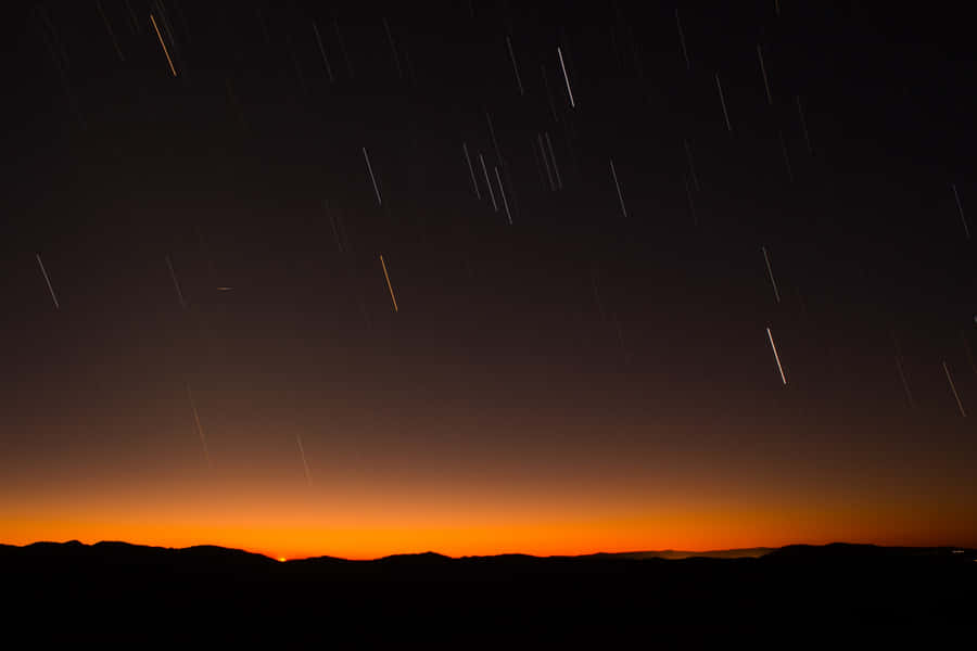 Meteor Shower In The Night Sky Wallpaper