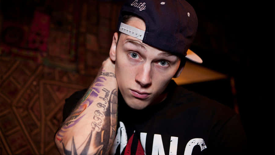 Mgk With Black Cap Wallpaper