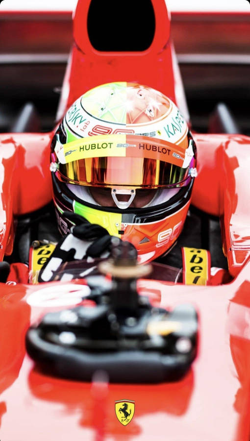 Mick Schumacher Riding Red Car Wallpaper