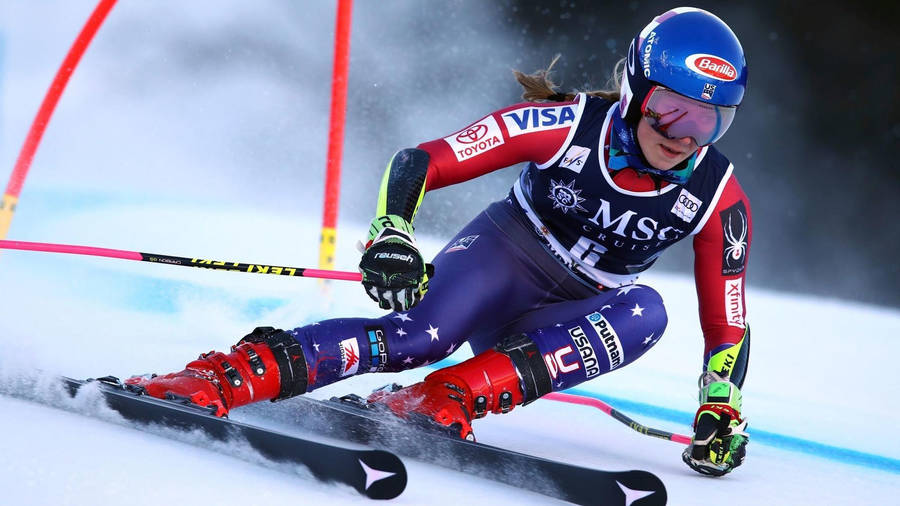 Mikaela Shiffrin In Downhill Alpine Skiing Action Wallpaper