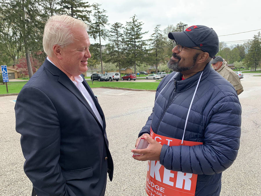 Mike Gibbons Smiling With Volunteer Wallpaper