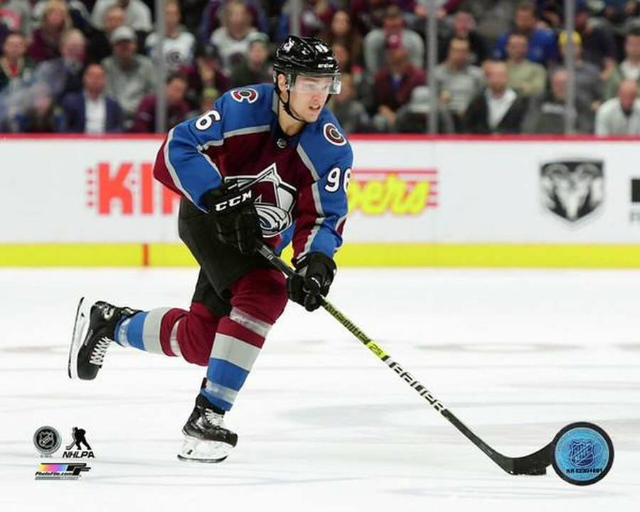 Mikko Rantanen Dribbling Hockey Puck During Game Wallpaper