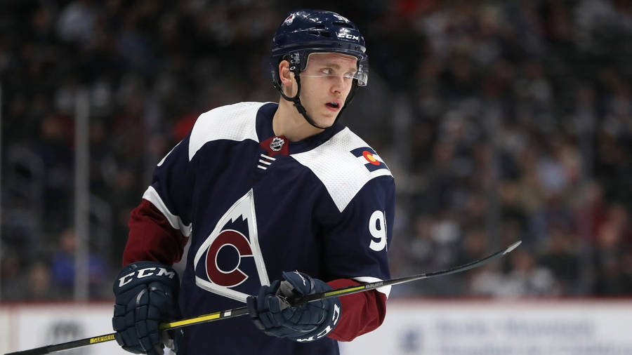 Mikko Rantanen Wearing Jersey With Alternate Logo Looking To The Left Wallpaper