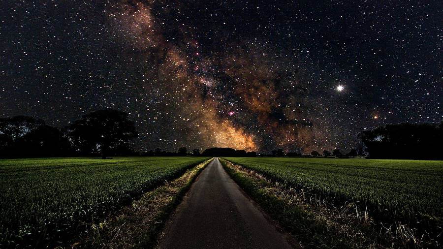 Milky Way In A Long Road Wallpaper