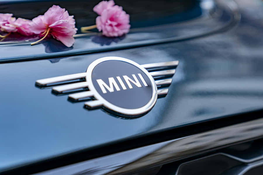 Mini Cooper Logowith Pink Flowers Wallpaper