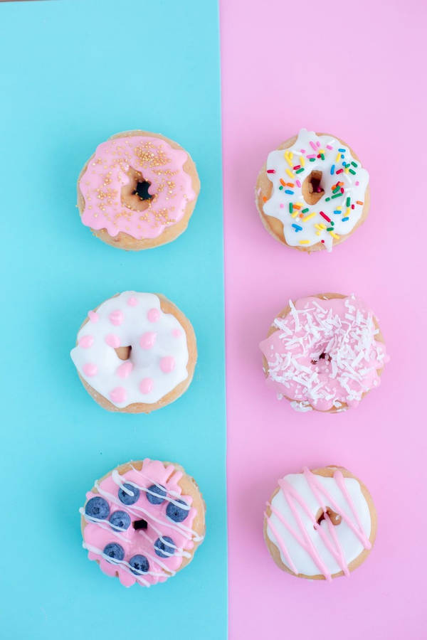 Minimalist Doughnuts With Candies Wallpaper