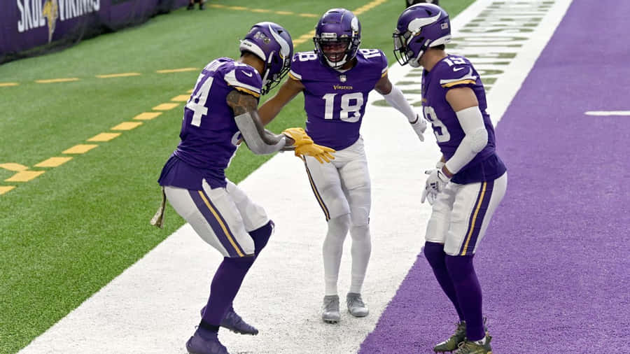 Minnesota Vikings Players Performing Griddy Celebration Wallpaper