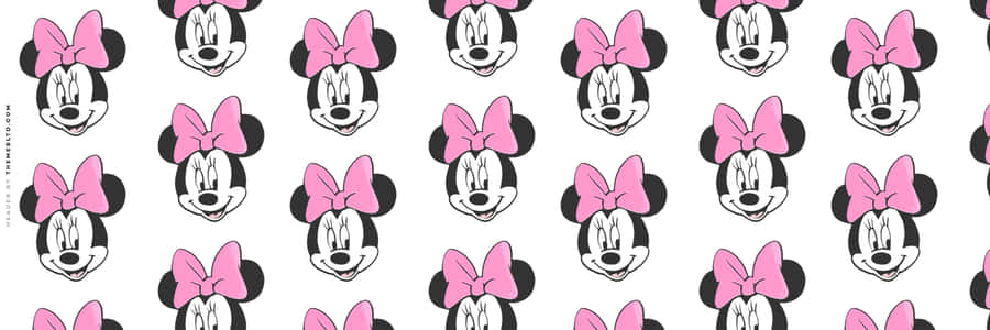 Minnie Mouse In Her Signature Pink Outfit Wallpaper