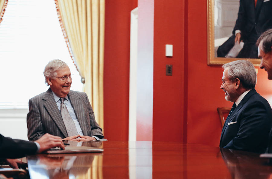 Mitch Mcconnell In Room With Red Paint Wallpaper