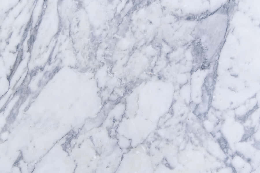 Modern Marble Desktop Overlooking City Skyline Wallpaper