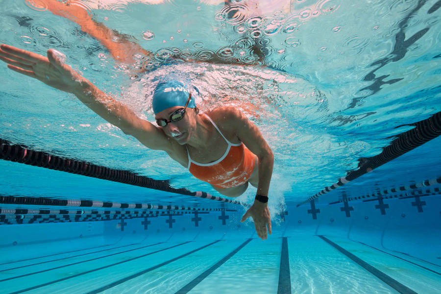 Modern Pentathlon Athlete Swimming With Apple Watch Wallpaper