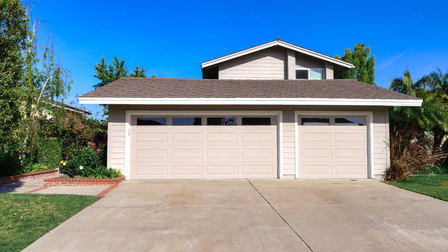 Modern Vintage Home Garage With Sprawling Driveway Wallpaper