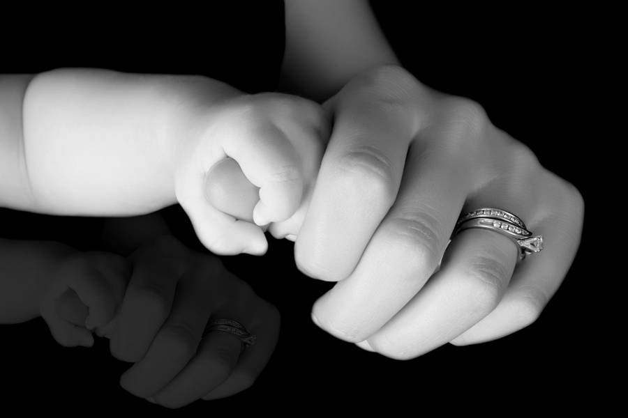 Mom And Son Holding Fingers Wallpaper