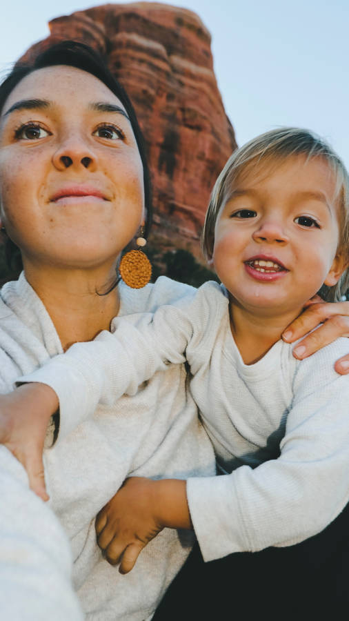 Mom And Son Wearing White Wallpaper