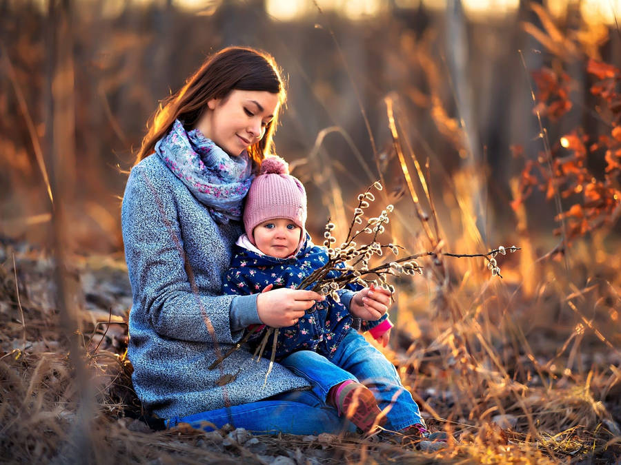 Mom And Son With Flowers Wallpaper