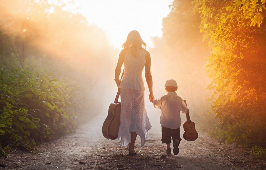 Mom And Son With Guitars Wallpaper