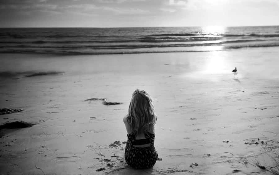 Monochrome Lonely Girl On Beach Wallpaper