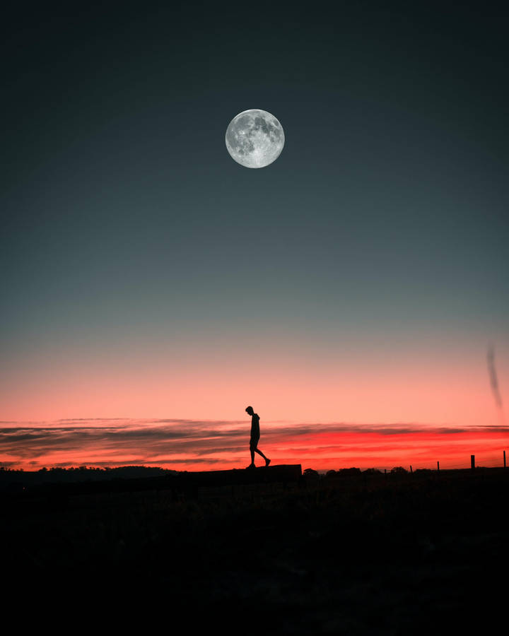 Moon And Man Alone Phone Background Wallpaper