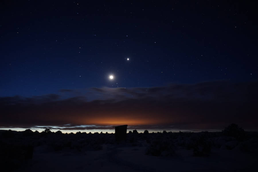 Moon In A Starry Night Sky Wallpaper