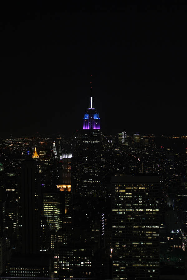 Moonlit Skyline Of The Empire State, New York At Night On Iphone Wallpaper Wallpaper