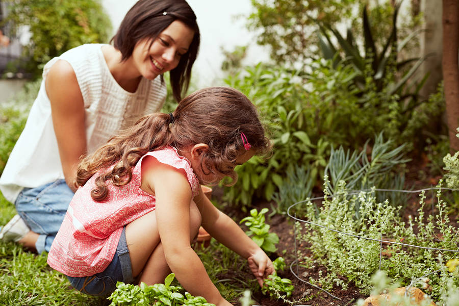 Mother And Daughter Gardening Wallpaper