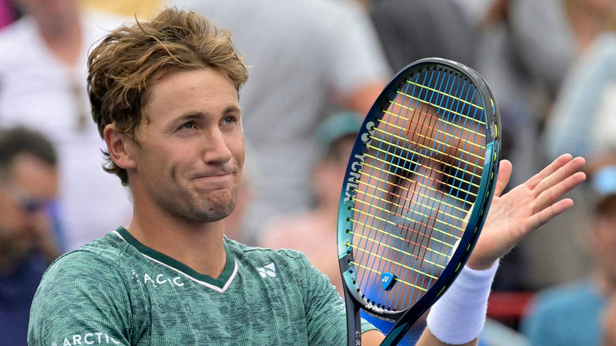 Motivated Casper Ruud Clapping With His Racket After A Successful Match Wallpaper