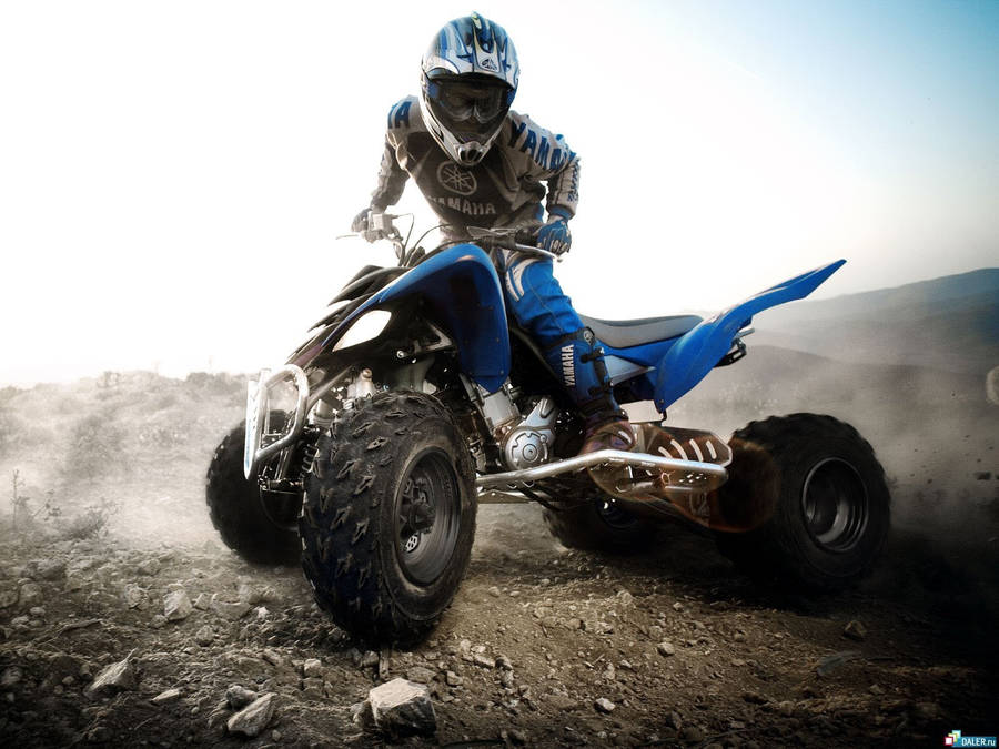 Motocross Atv Blue Rocky Terain Wallpaper