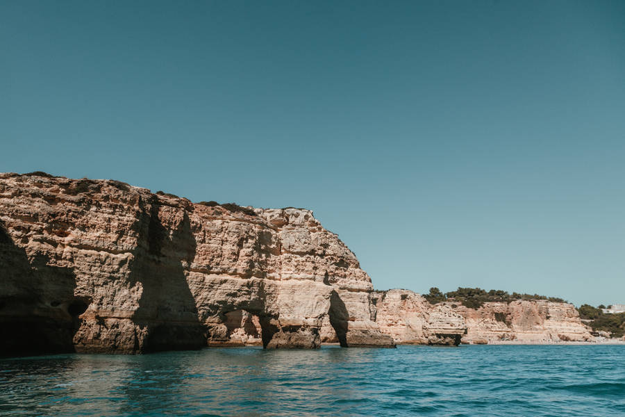 Mountain Cliff Near Azure Water Wallpaper