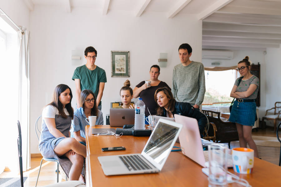 Multidisciplinary Team Collaborating At Workspace Wallpaper