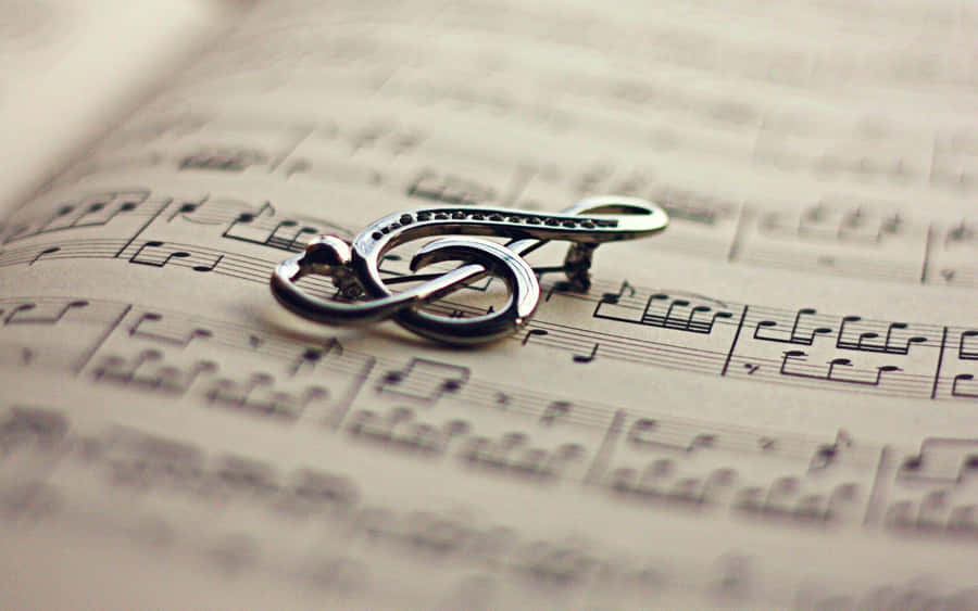 Musical Notes Floating On A Colorful Background Wallpaper