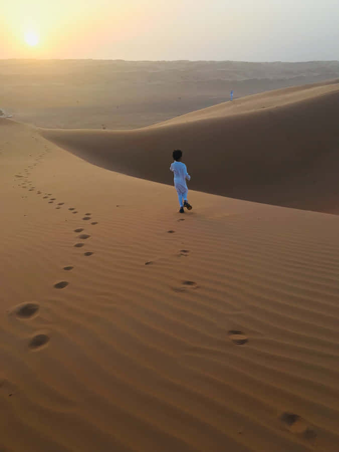 Muslim Boy In The Desert Wallpaper