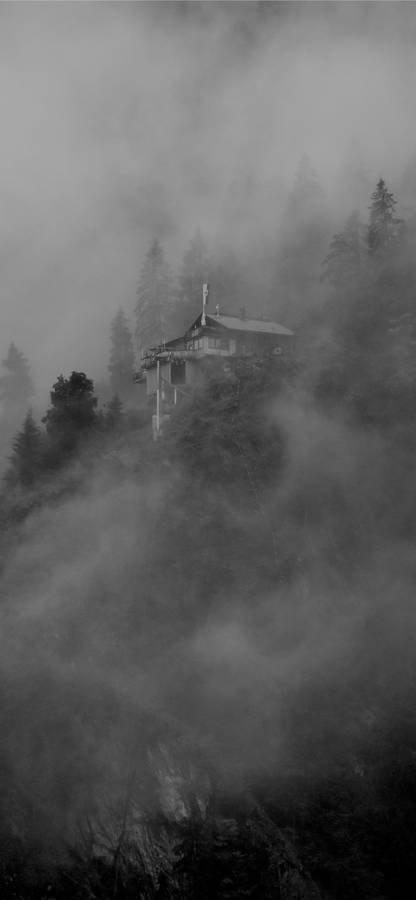 Mysterious Cliff House In Black And White Wallpaper