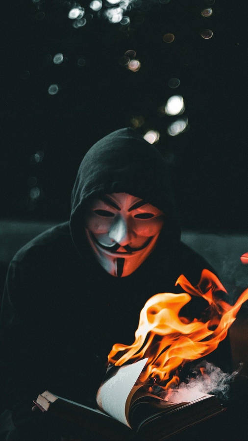 Mysterious Hacker In Shadowy Flames Wallpaper